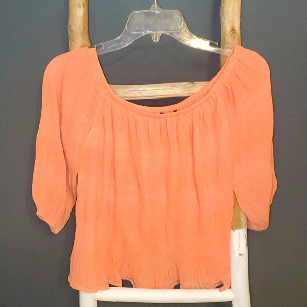 Express peach crinkle pleated off-the-shoulder crop top. 3/4 length sheer sleeve